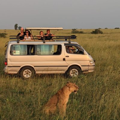 Travelers embark on a thrilling game drive aboard a safari truck during their 2-Day Murchison Falls Park Safari in Uganda.