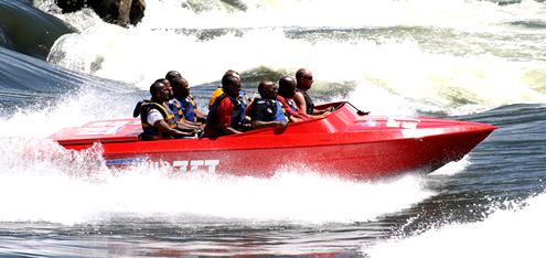 Jet boat speeding through Uganda River Expeditions