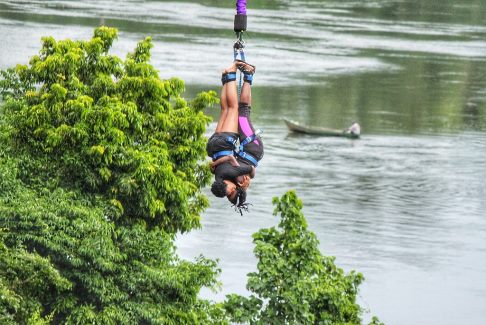 Bungee jumper touching the water of the Nile